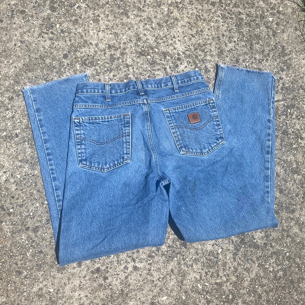Men’s Carhart skinny straight jeans size 32X 32 cut right above hem.